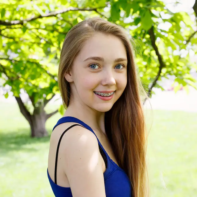 girl smiling with orthodontic braces