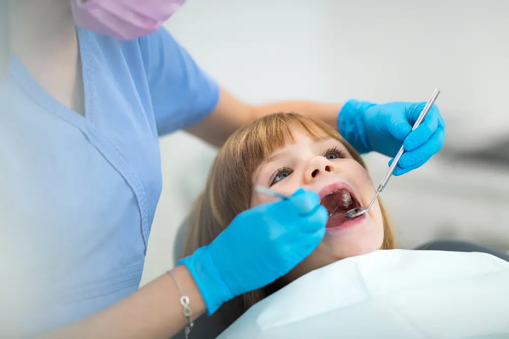 Little girl getting dental care